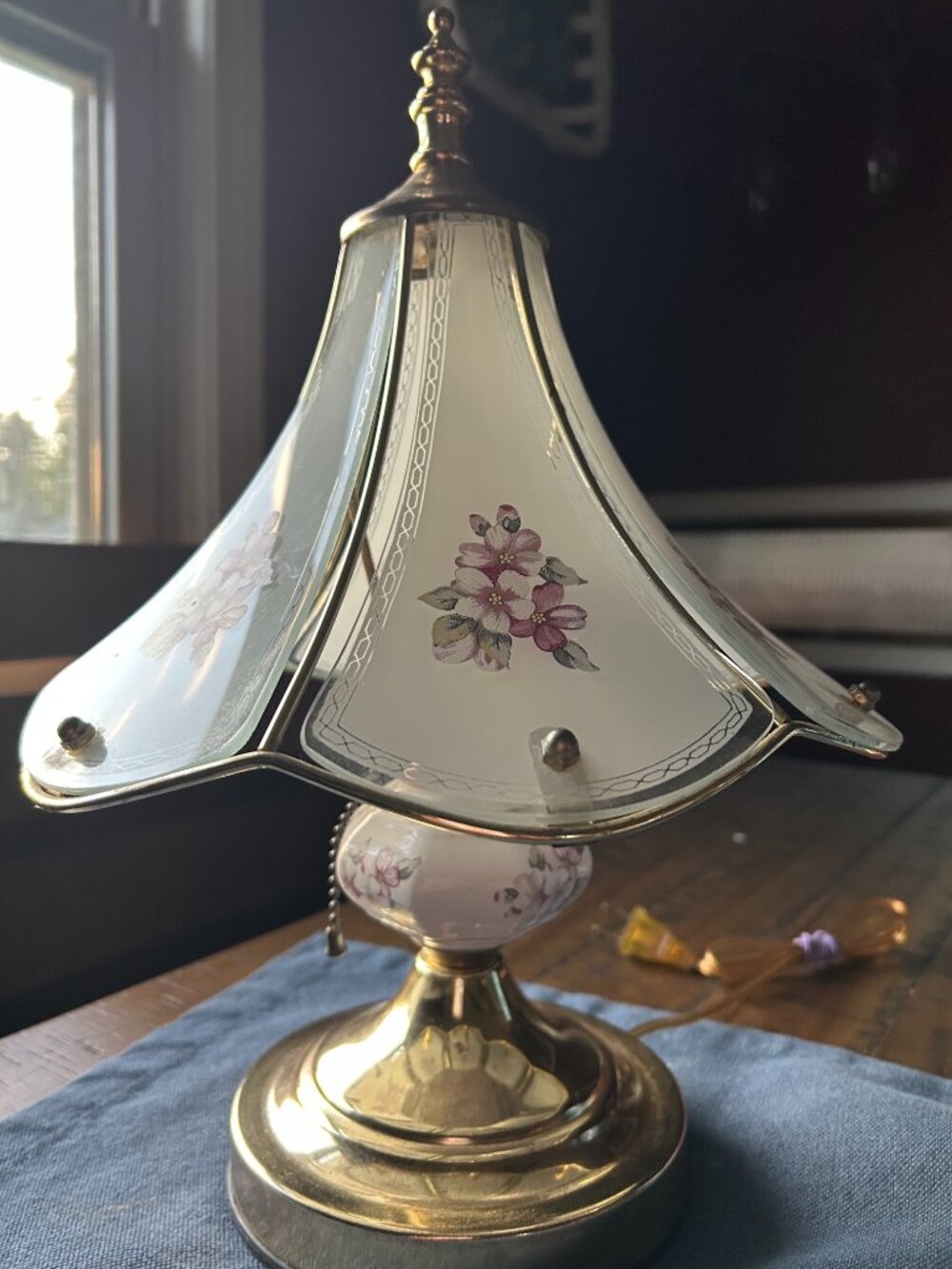 Vintage Hollywood Regency Style Brass table lamp featuring curved frosted glass